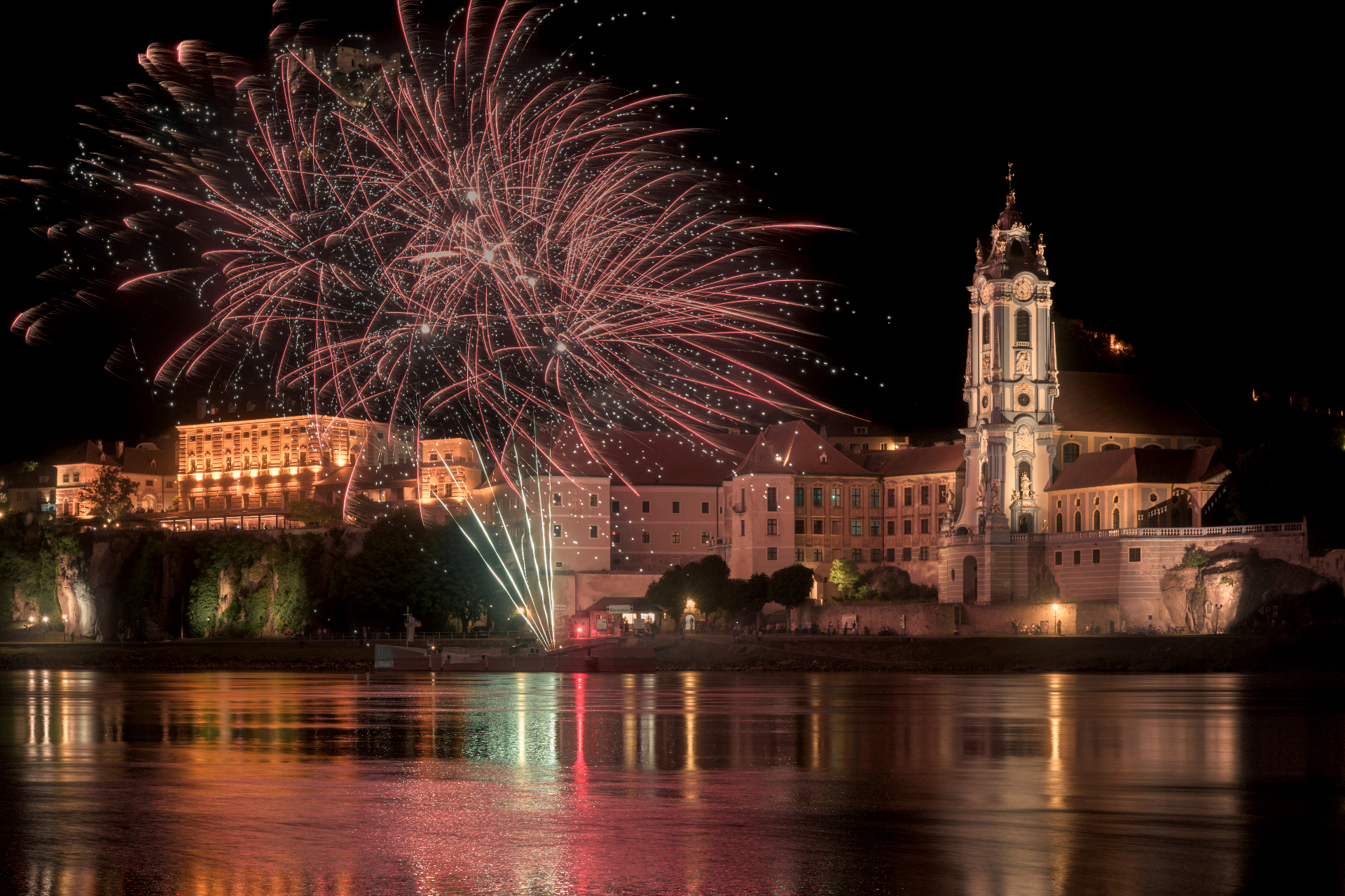 Fireworks above Dürnstein during the Wachau Solstice Celebration 2026 — photographed from Rossatz across the Danube by Peter Scholz.