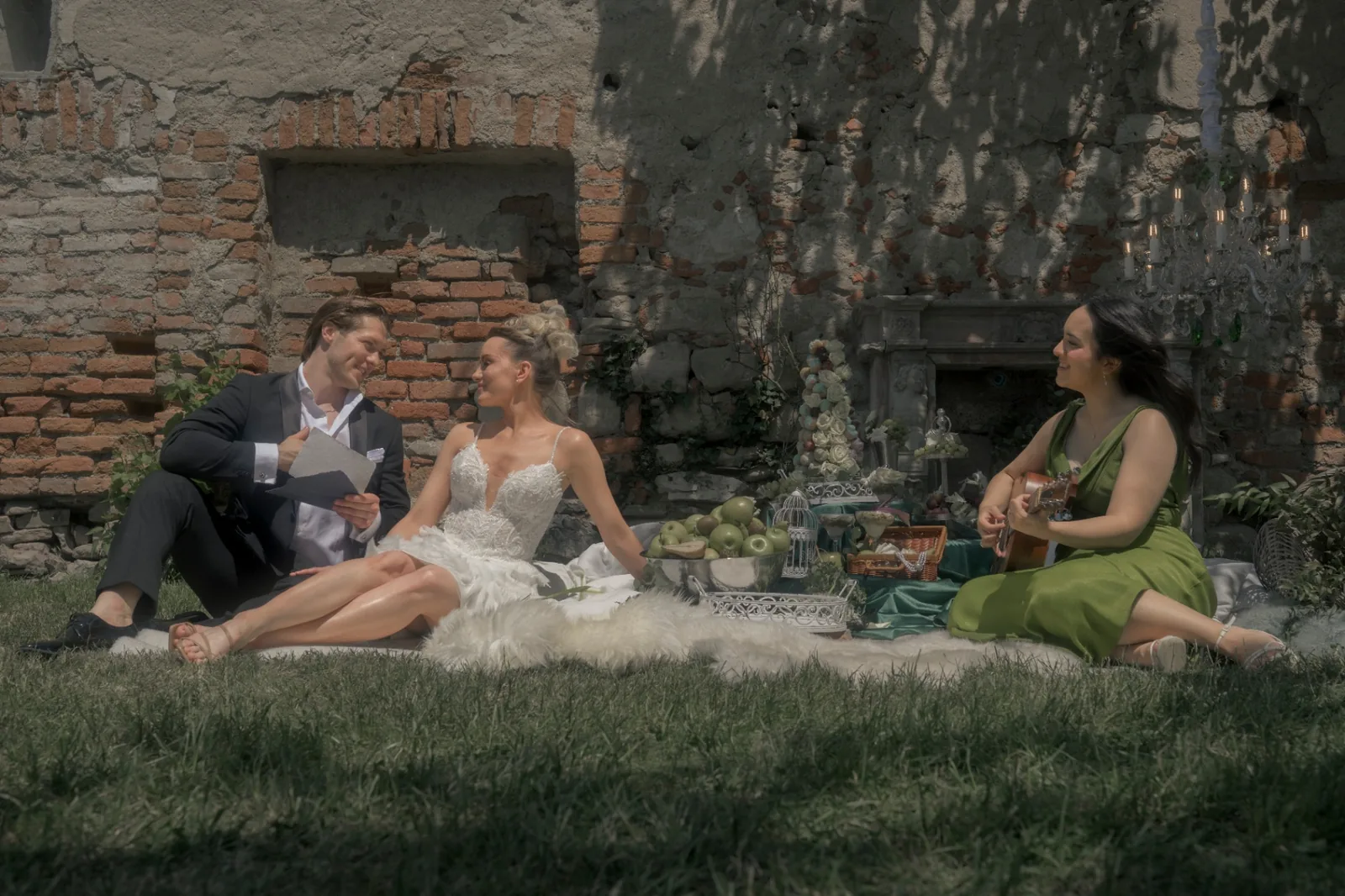 Editorial wedding moment with the couple seated close beside live acoustic music at Schloss Haggenberg.