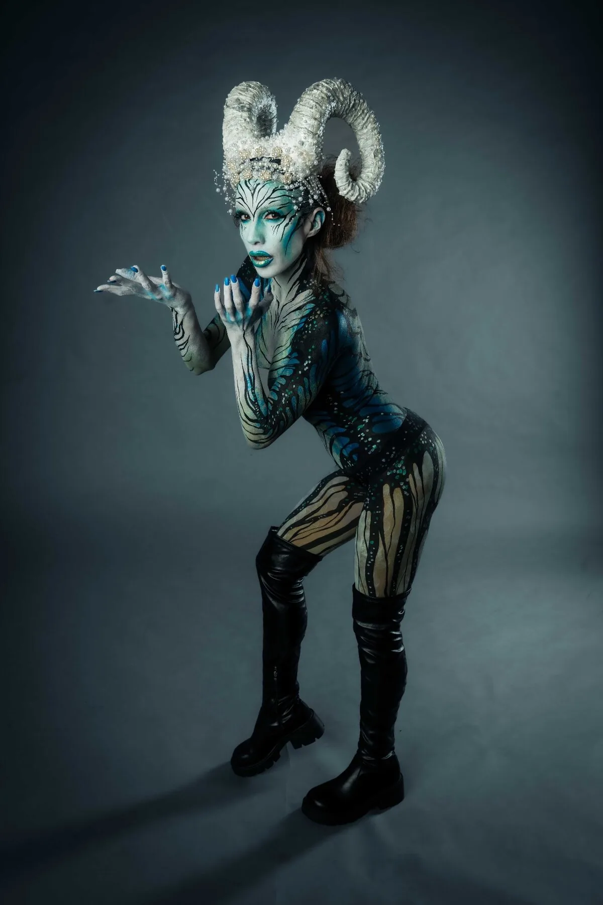 Otherworldly beauty portrait photography - professional body art collaboration Vienna blue tones dramatic lighting