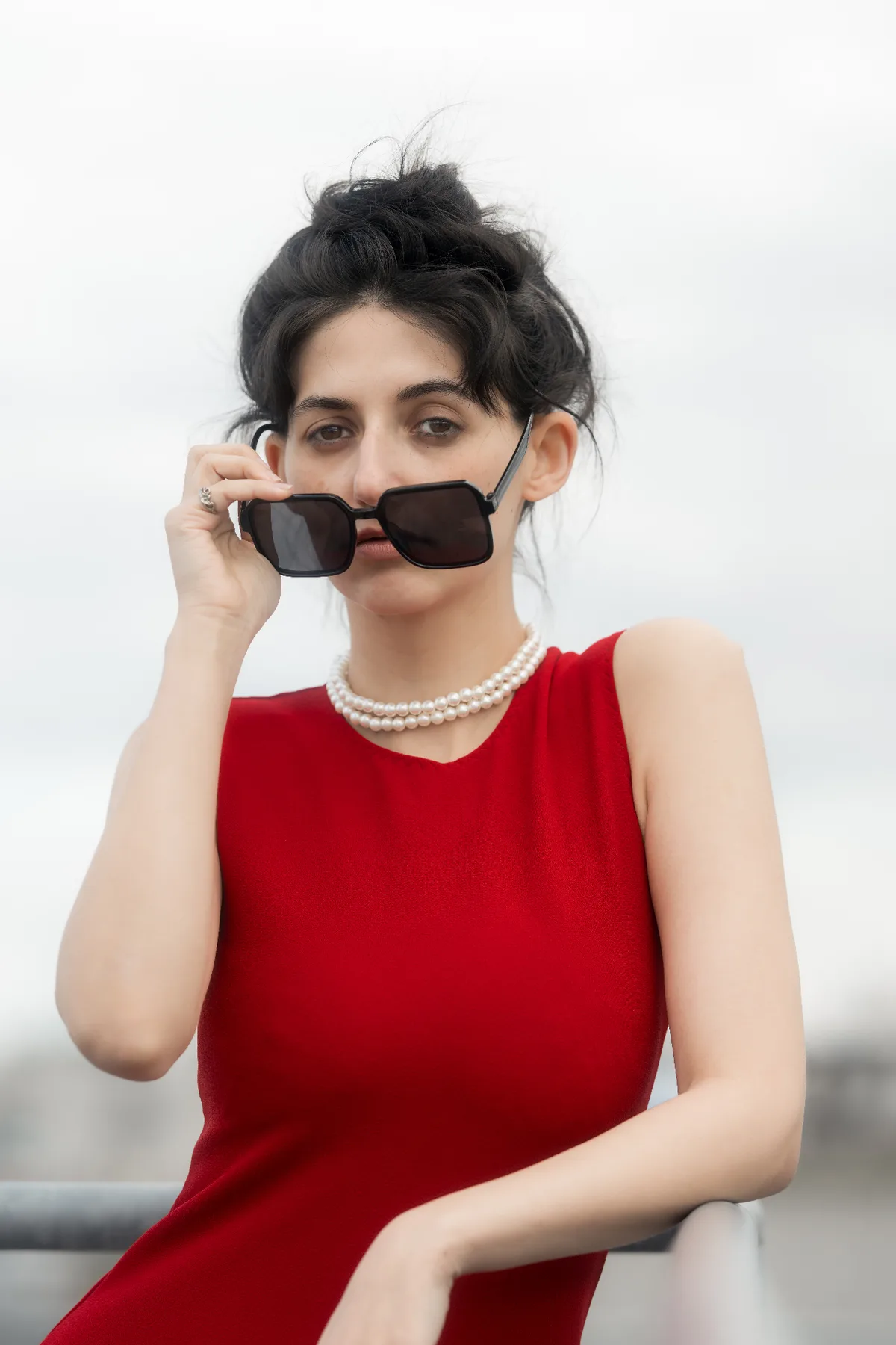 Composed editorial executive portrait in red — corporate storytelling photography Europe