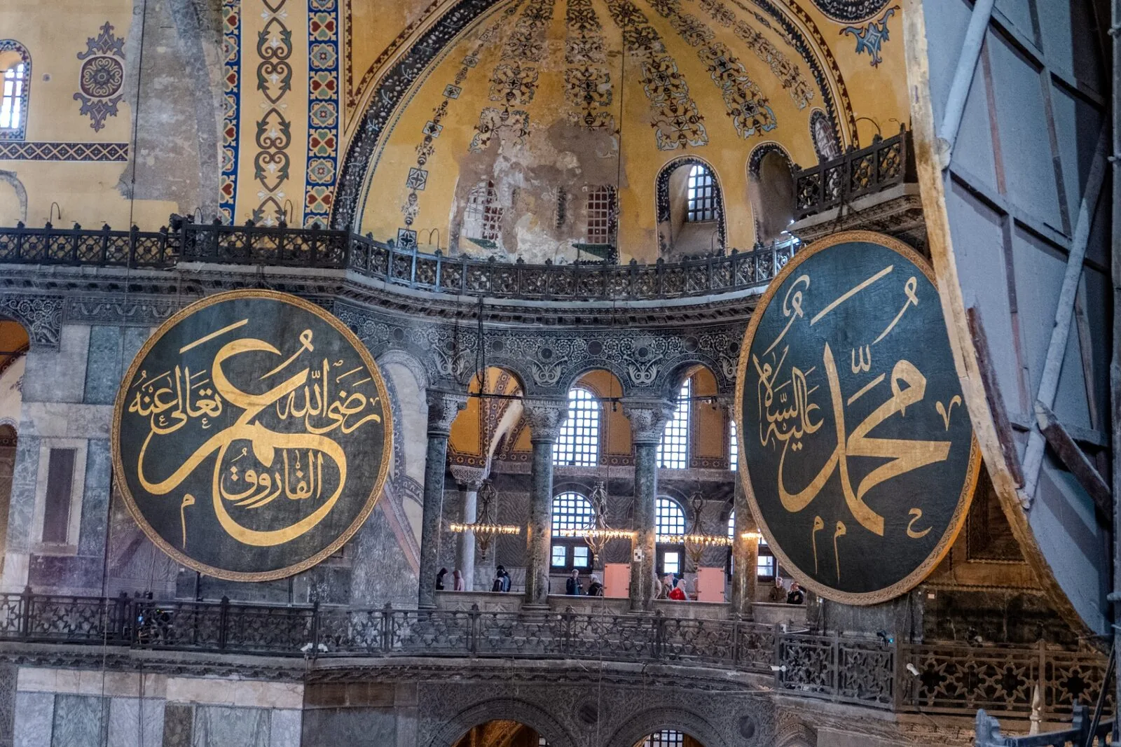 Hagia Sophia Istanbul interior view showing Byzantine and Ottoman art fusion with Islamic calligraphy medallions and historic architecture photography by Peter Scholz