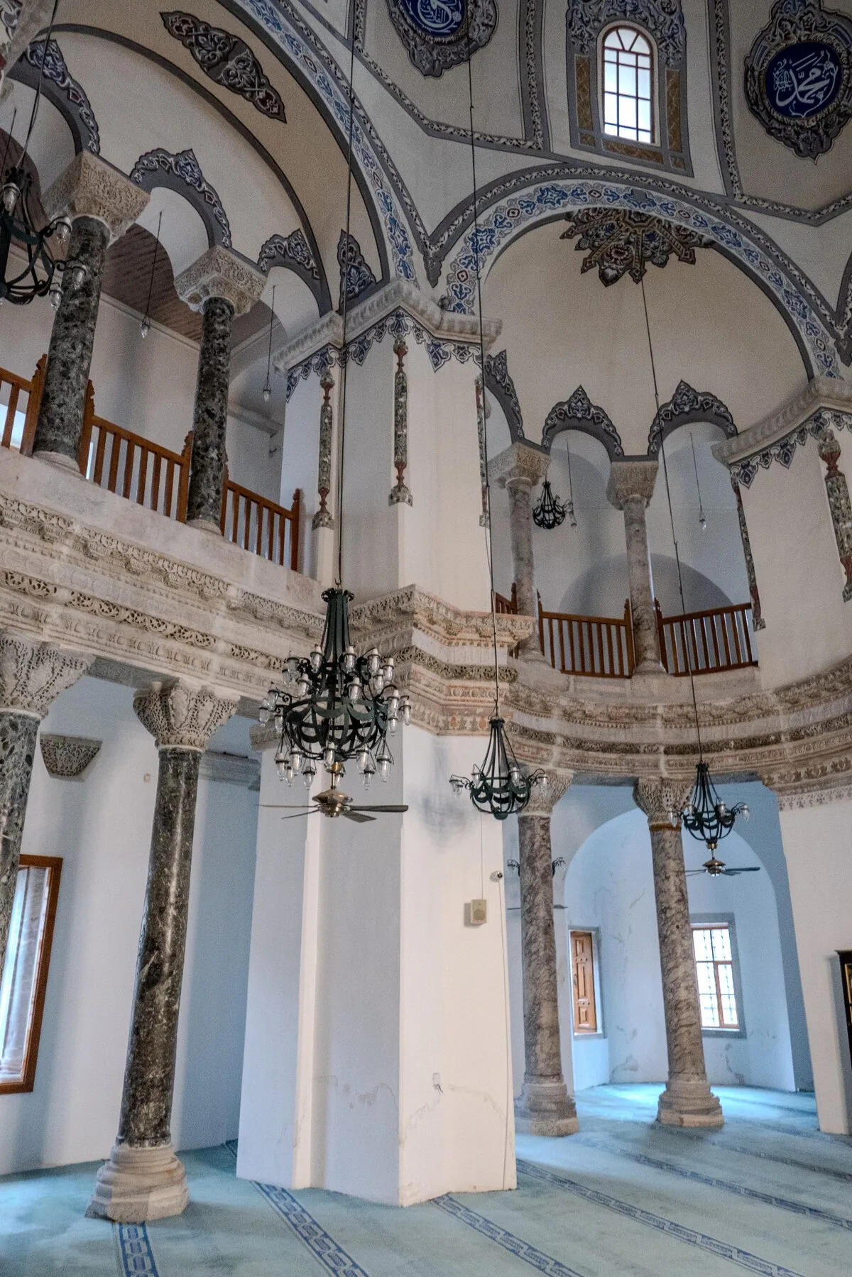 Little Hagia Sophia marble columns supporting gallery level with ornate Byzantine capitals and arches
