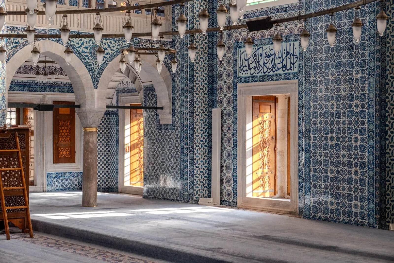Rüstem Pasha Mosque Istanbul interior with colorful Iznik tiles sunlight streaming through doorways