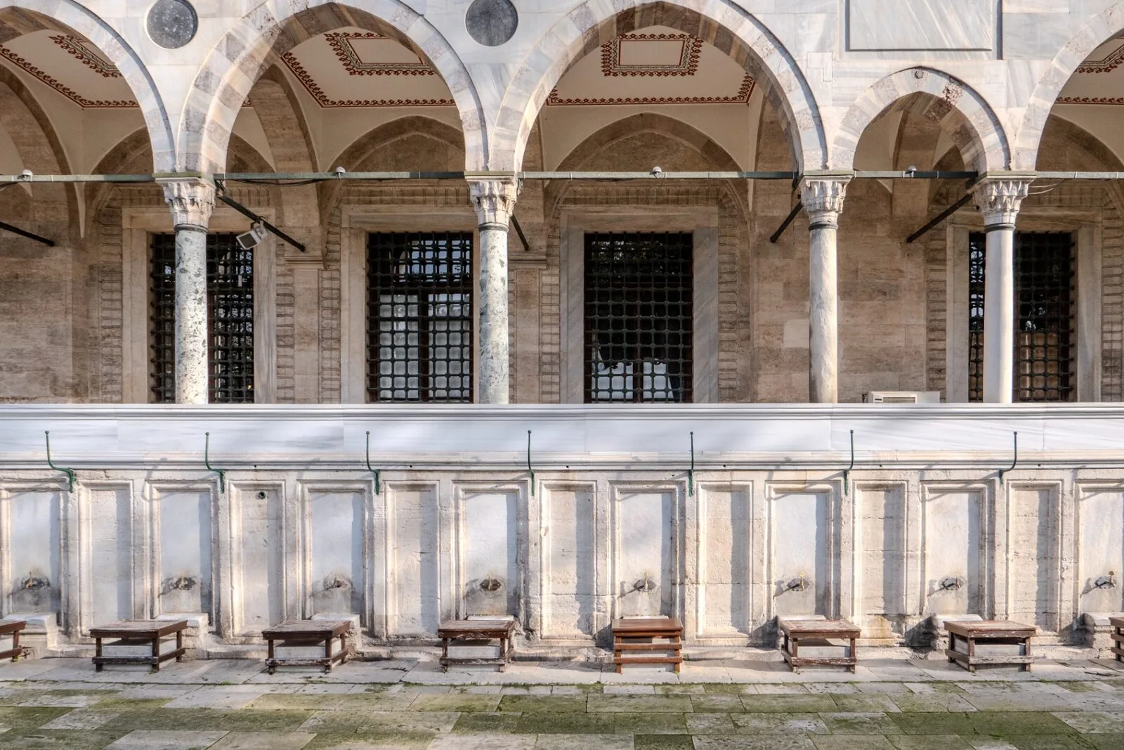 Süleymaniye courtyard arcade with marble columns and arched portico by Mimar Sinan