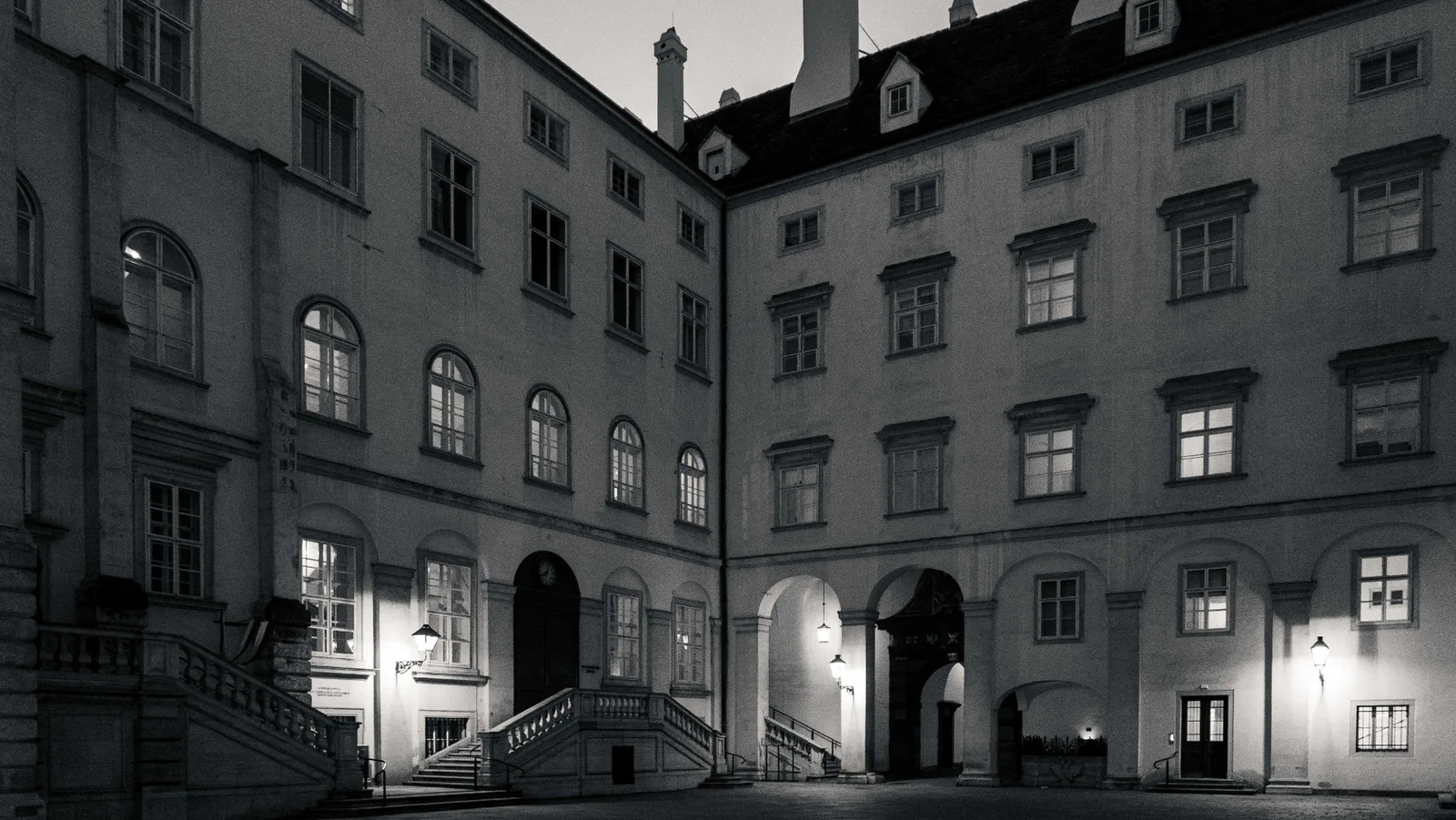 Vienna Hofburg courtyard — black and white, staircase and arched passages at dusk, Leica D-LUX 8 by schopho