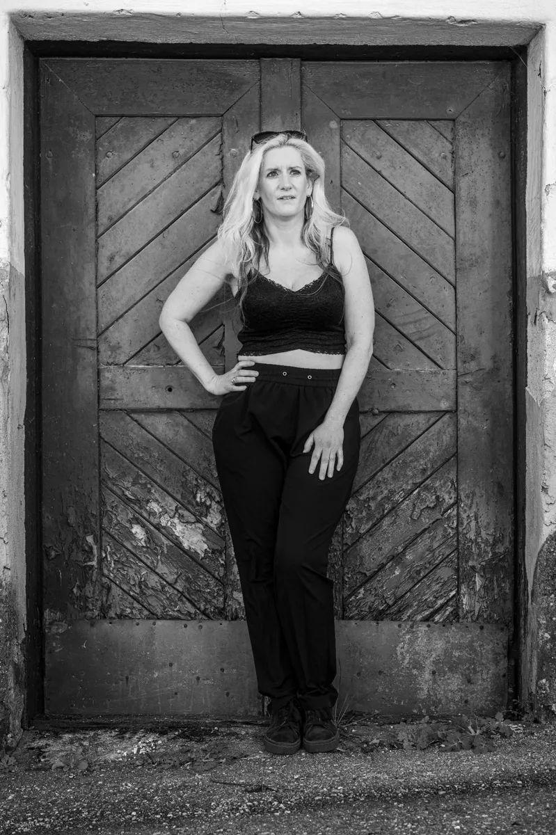 Quiet ending portrait Quiet ending portrait — framed by rustic double door, centered symmetry, contemplative fine art by schopho