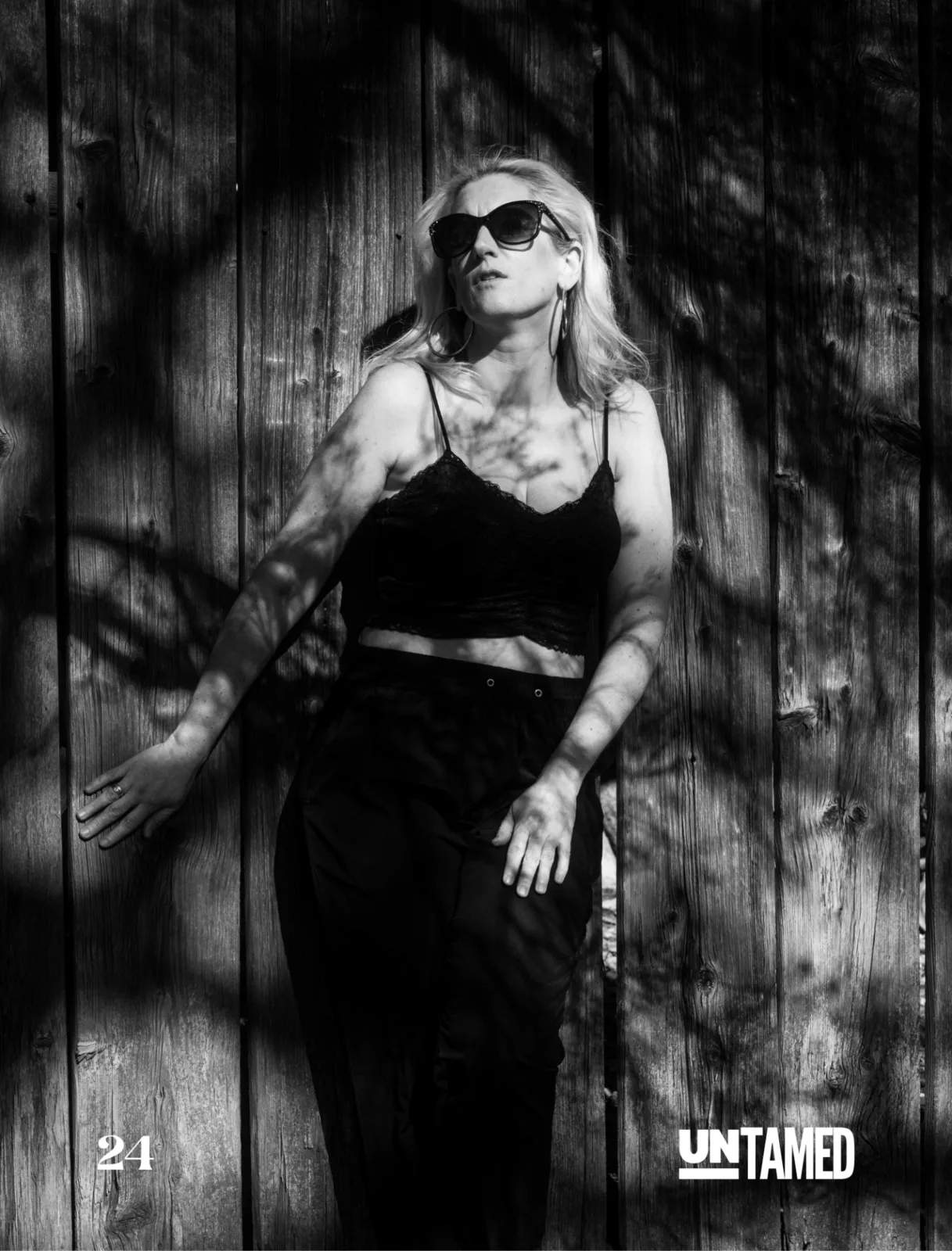 Untamed Fashion Vol. 277 editorial spread — black and white full-body portrait by Peter Scholz with directional light and quiet atmosphere