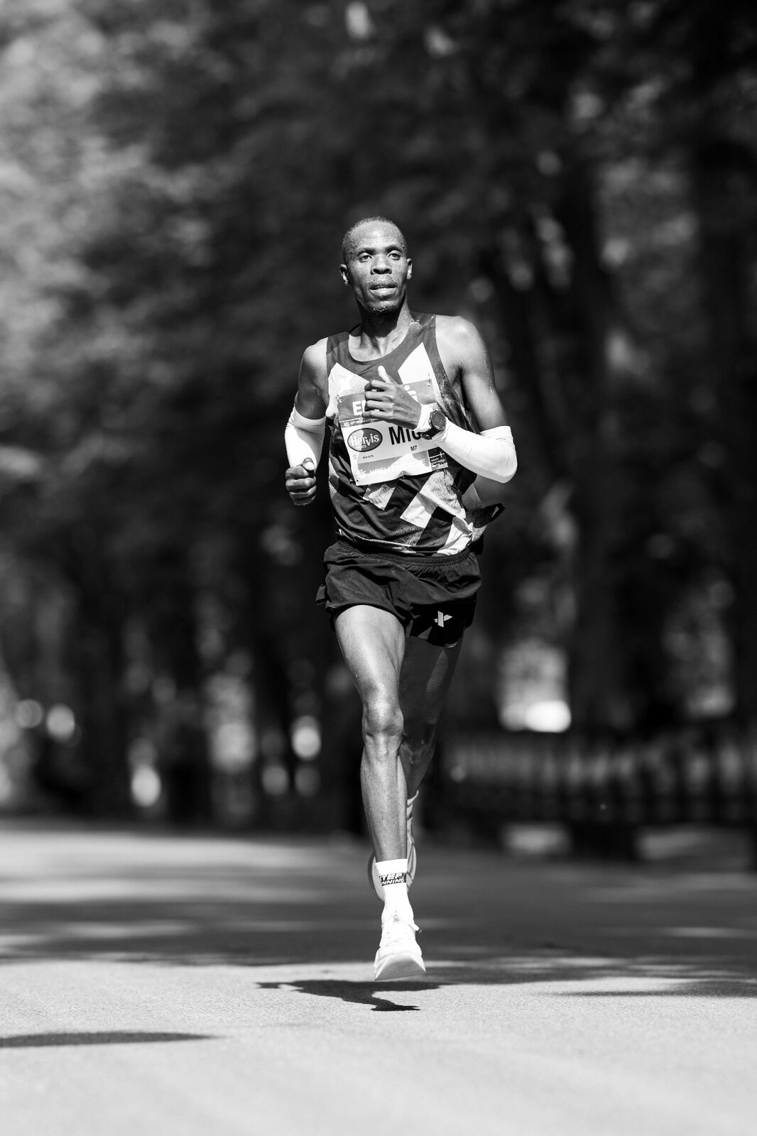 Vienna City Marathon 2026 — runners on the Ringstrasse with grand 19th century architecture, black and white photography by Peter Scholz, schopho