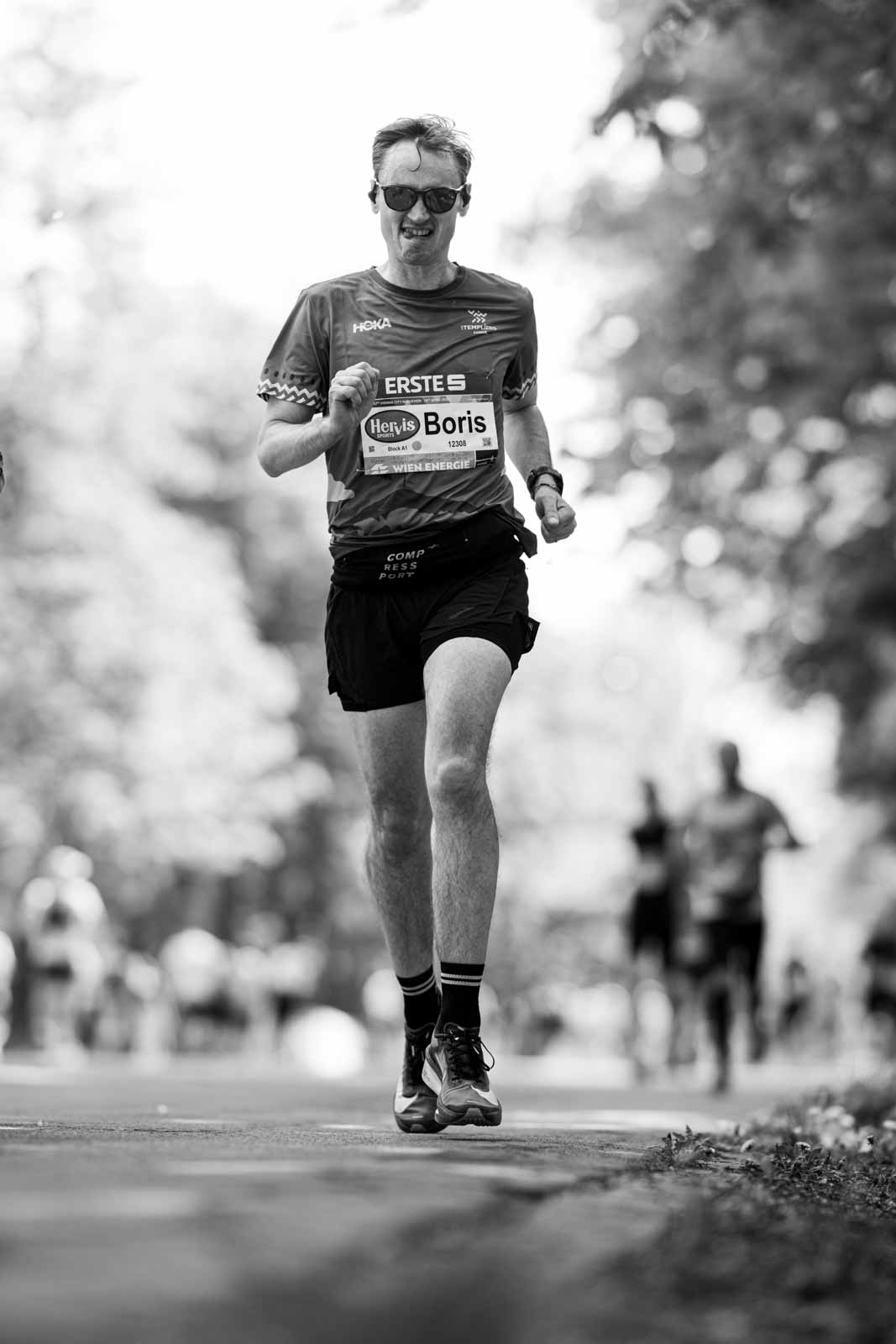 Marathon runner Boris running head-on through the Prater Hauptallee — black and white fine art photography by schopho