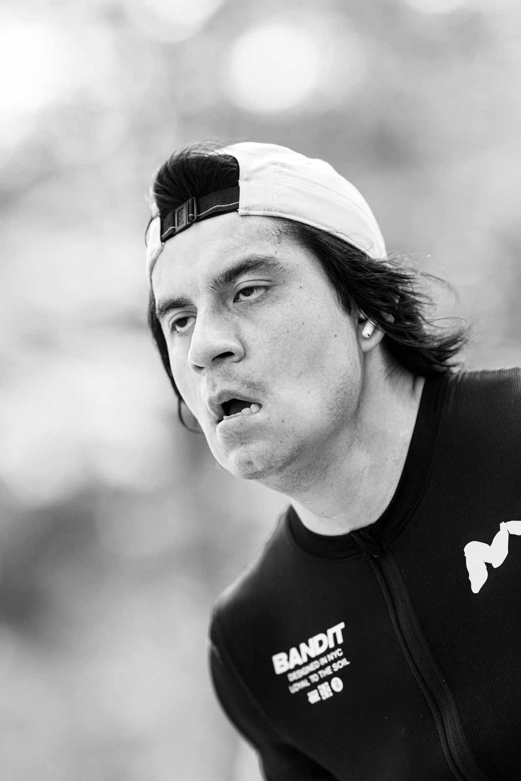 Intense portrait of a long-haired marathon runner with Bandit NYC singlet — black and white fine art photography by Peter Scholz, schopho