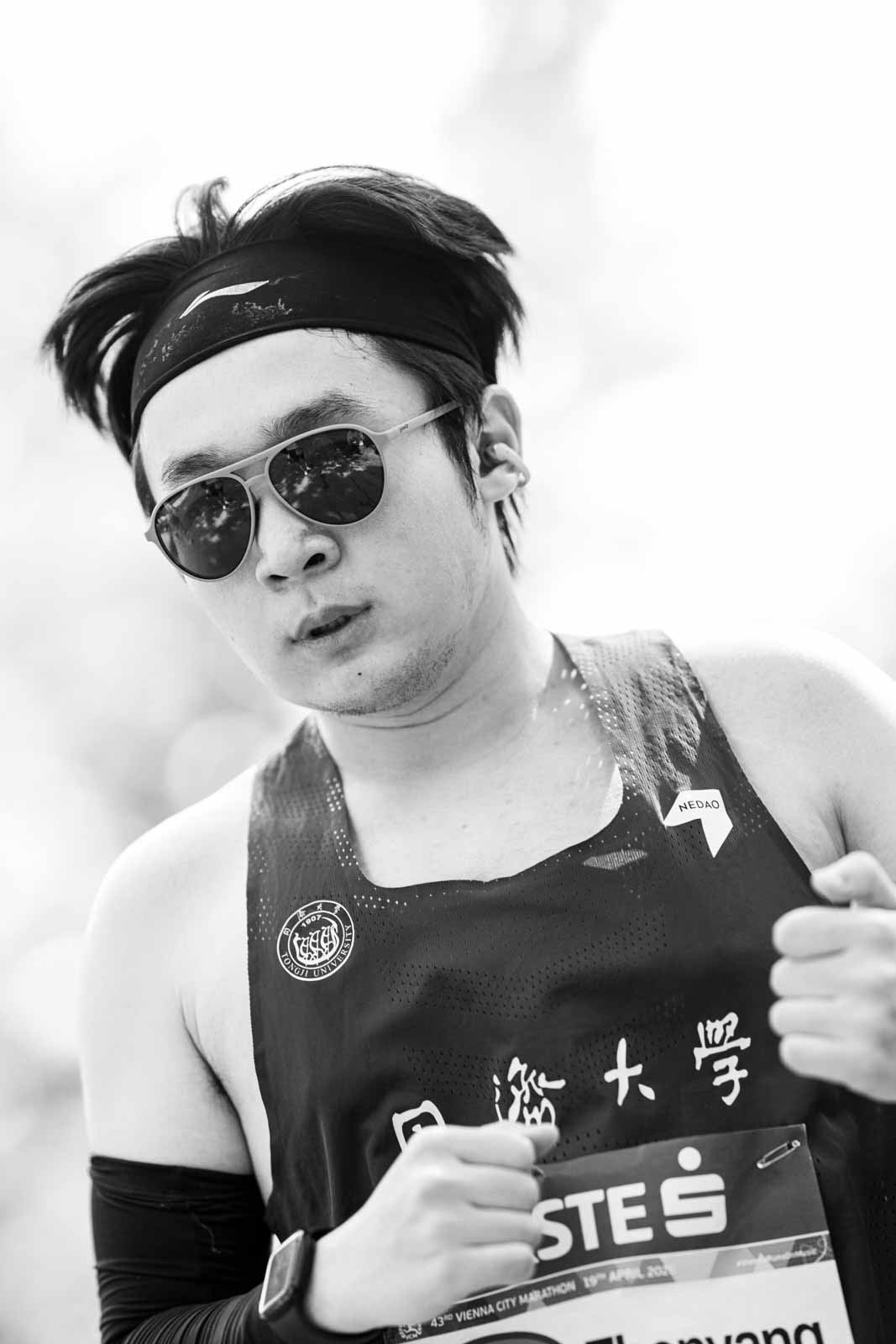 Marathon runner Zhenyang from Tongji University with headband and aviator sunglasses — black and white fine art photography by schopho